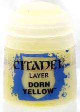 Small pale yellow paint pot with a white screw-on lid and a blue-and-yellow label. The label reads “CITADEL,” “LAYER,” and “DORN YELLOW.”