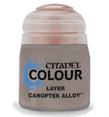 A small gray paint pot with a pale pinkish-gray ridged lid, shown upright against a white background. Its label has a blue splash graphic and the black text “CITADEL COLOUR,” “LAYER,” and “CANOPTEK ALLOY.”