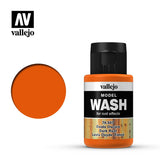 Vallejo Model Wash bottle with a black cap, orange bands and a label reading “MODEL WASH” and “Dark Rust,” beside a solid orange color swatch. The label also shows a rust-textured strip and the text “for rust effects.”