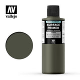 A dark olive-green Vallejo Surface Primer bottle with a black cap stands beside a matching circular color swatch. The label reads “SURFACE PRIMER” and “Russian Green 4BO,” with the Vallejo logo above.