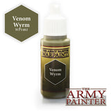 Small paint bottle with a white dropper cap and olive-green liquid or label, marked “Venom Wyrm” and “WARPAINTS.” An enlarged olive hexagon swatch reads “Venom Wyrm,” beside the “THE ARMY PAINTER” logo.