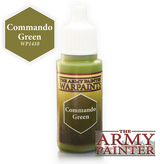 A small dropper bottle of olive-green paint with a white ribbed cap and yellow label reading “THE ARMY PAINTER WARPAINTS” and “Commando Green.” A matching olive hexagon marked “Commando Green” and “WP1410” appears beside it, with The Army Painter logo at lower right.
