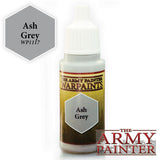 A white dropper bottle of Ash Grey paint stands upright, with a gold-and-brown label, a gray hexagon marked “Ash Grey,” and “WARPAINTS.” A larger gray “Ash Grey WP117” swatch appears beside it, with “THE ARMY PAINTER” logo at lower right.
