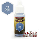 A white dropper bottle of paint with a yellow and dark green label, a blue-gray hexagon marked “Fog Grey,” and “THE ARMY PAINTER WARPAINTS” lettering. A larger matching hexagon above reads “Fog Grey” and “WP1427,” beside the “THE ARMY PAINTER” logo.