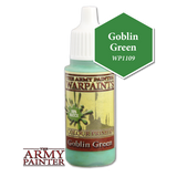 A small bottle of pale green Goblin Green paint with a tall white pointed cap is shown upright against a black background. Its vintage-style label reads “THE ARMY PAINTER WARPAINTS” and “COLOUR PRIMERS”; a green hexagon beside it reads “Goblin Green” and “WP1109.”
