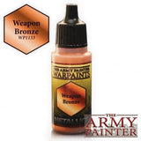 A small paint bottle with a black ribbed dropper cap and a gold-and-black label featuring a bronze hexagon marked “Weapon Bronze.” A matching “Weapon Bronze” swatch marked WP1133 appears at upper left, with “THE ARMY PAINTER” logo at lower right.