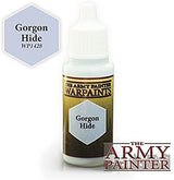 A small dropper bottle of hobby paint with a white ribbed cap and a dark olive-and-gold label. The label reads “THE ARMY PAINTER WARPAINTS” and “Gorgon Hide”; a matching hexagon color swatch also reads “Gorgon Hide WP1428.”