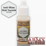 A white dropper bottle of varnish with a gold and brown label reading “THE ARMY PAINTER WARPAINTS” and “Anti-Shine Matt Varnish.” A hexagon beside it reads “Anti-Shine Matt Varnish” and “WP1103,” with a large “THE ARMY PAINTER” logo across the bottom.